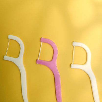 Handy floss sticks for easy tooth cleaning.